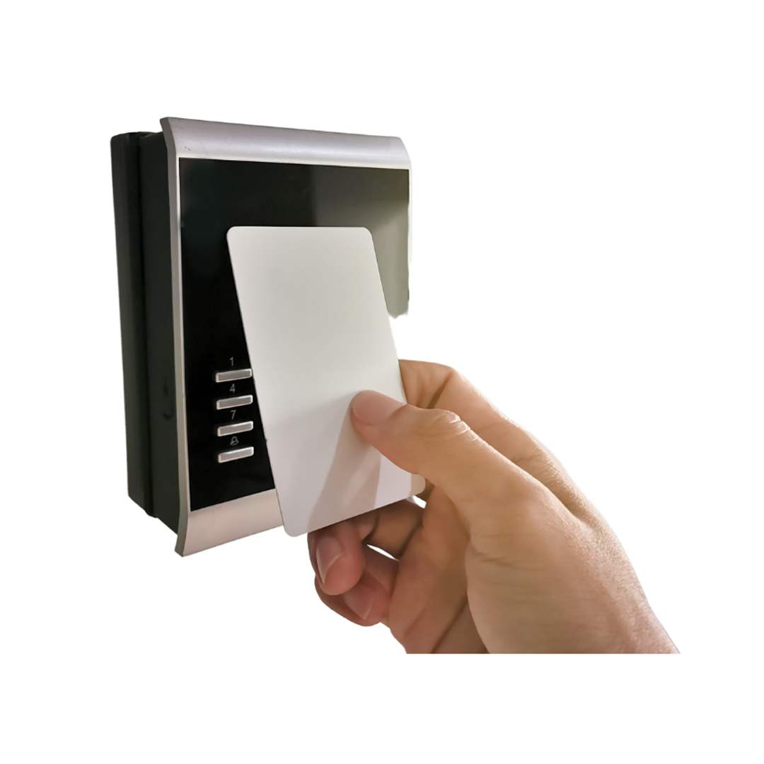 A person holding a credit card in front of a card reader, ensuring secure transaction through advanced security systems.