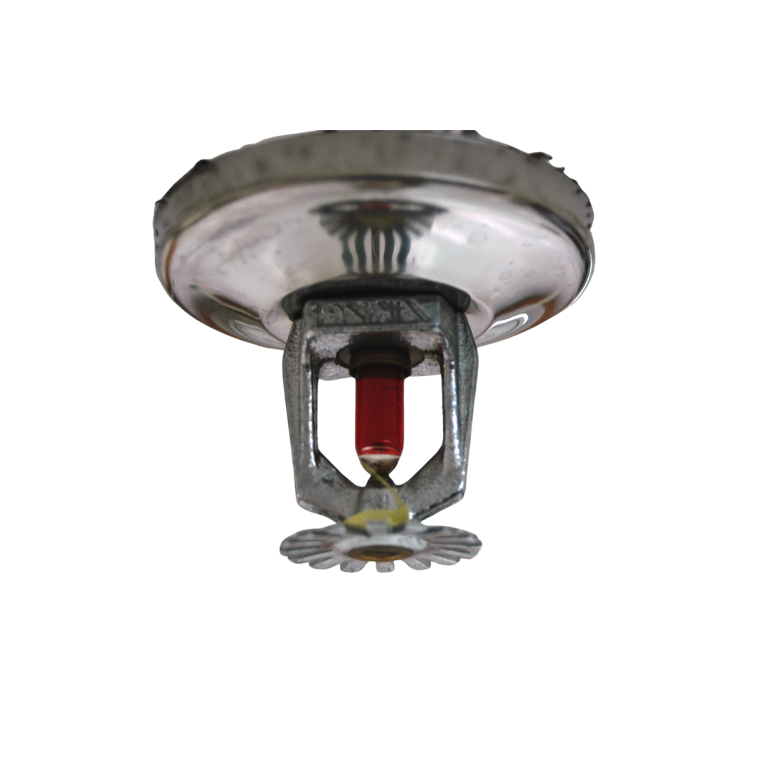 Close-up of a metal fire hydrant, showcasing its shiny surface, part of a wet fire sprinkler system for emergency use.