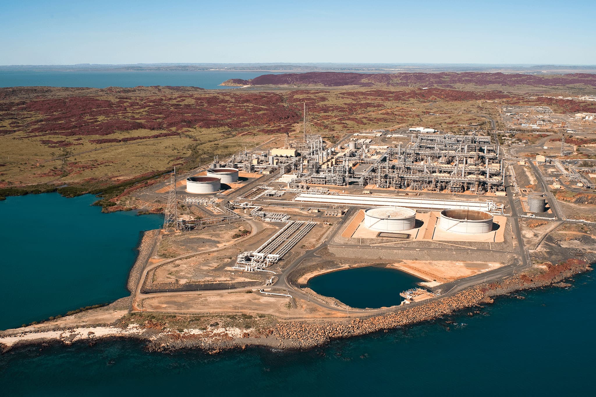 An aerial view of an oil refinery with fire safety equipment visible.