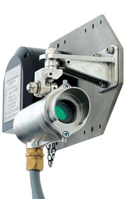 A metal wall-mounted water meter featuring a green light, part of the Searchline Excel Open Path Infrared Gas Detector system.