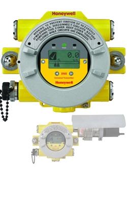 A yellow and white Sensepoint XCD electronic meter with a chain, designed for precise measurement and monitoring.