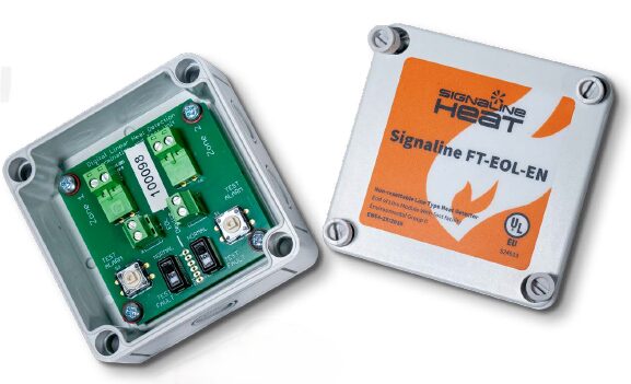 Two small electronic devices, the Signaline FT-EOL-EN End of Line Unit, are connected to each other for signal processing.